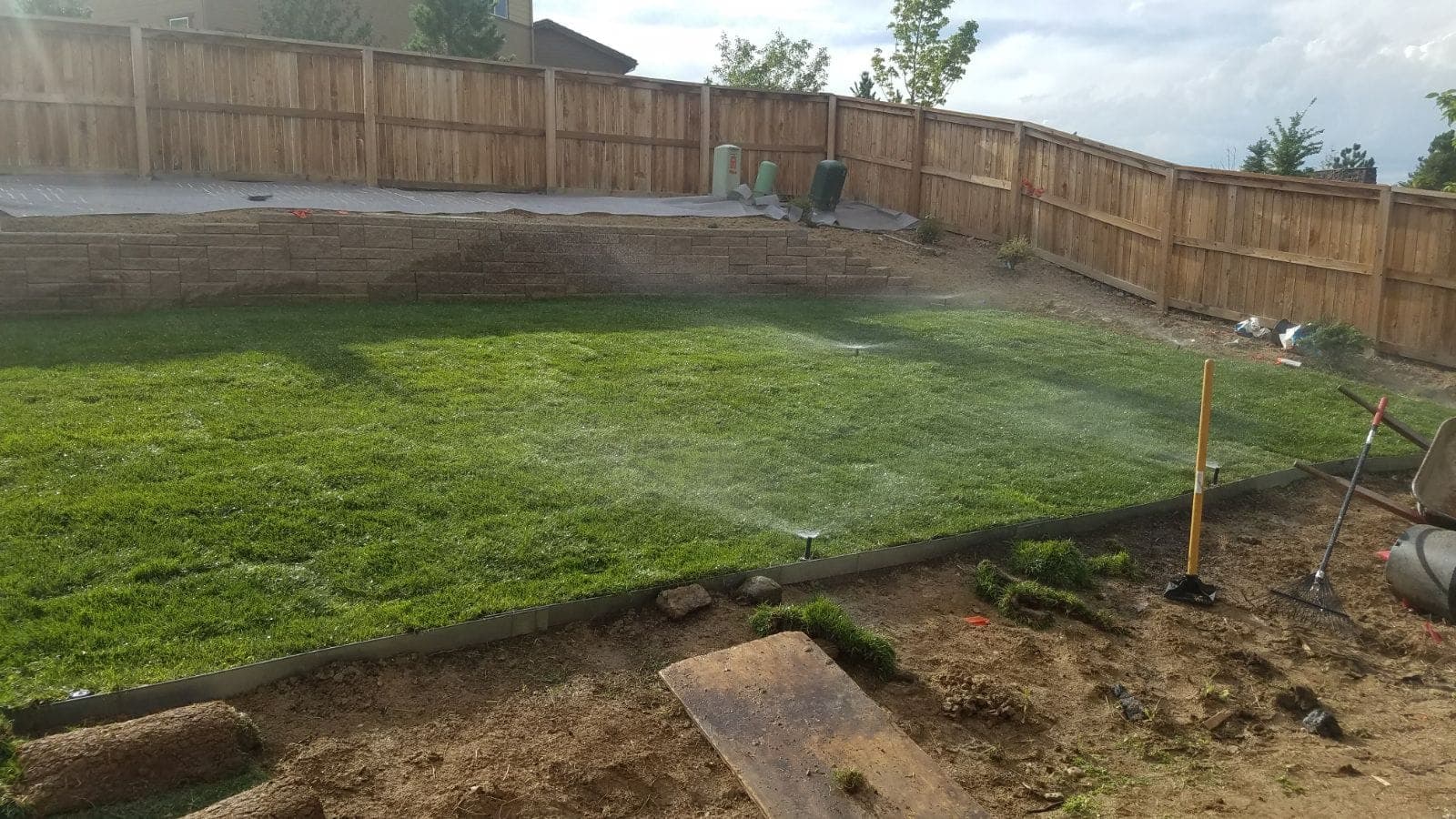 Garden irrigation sprinkler watering a new lawn